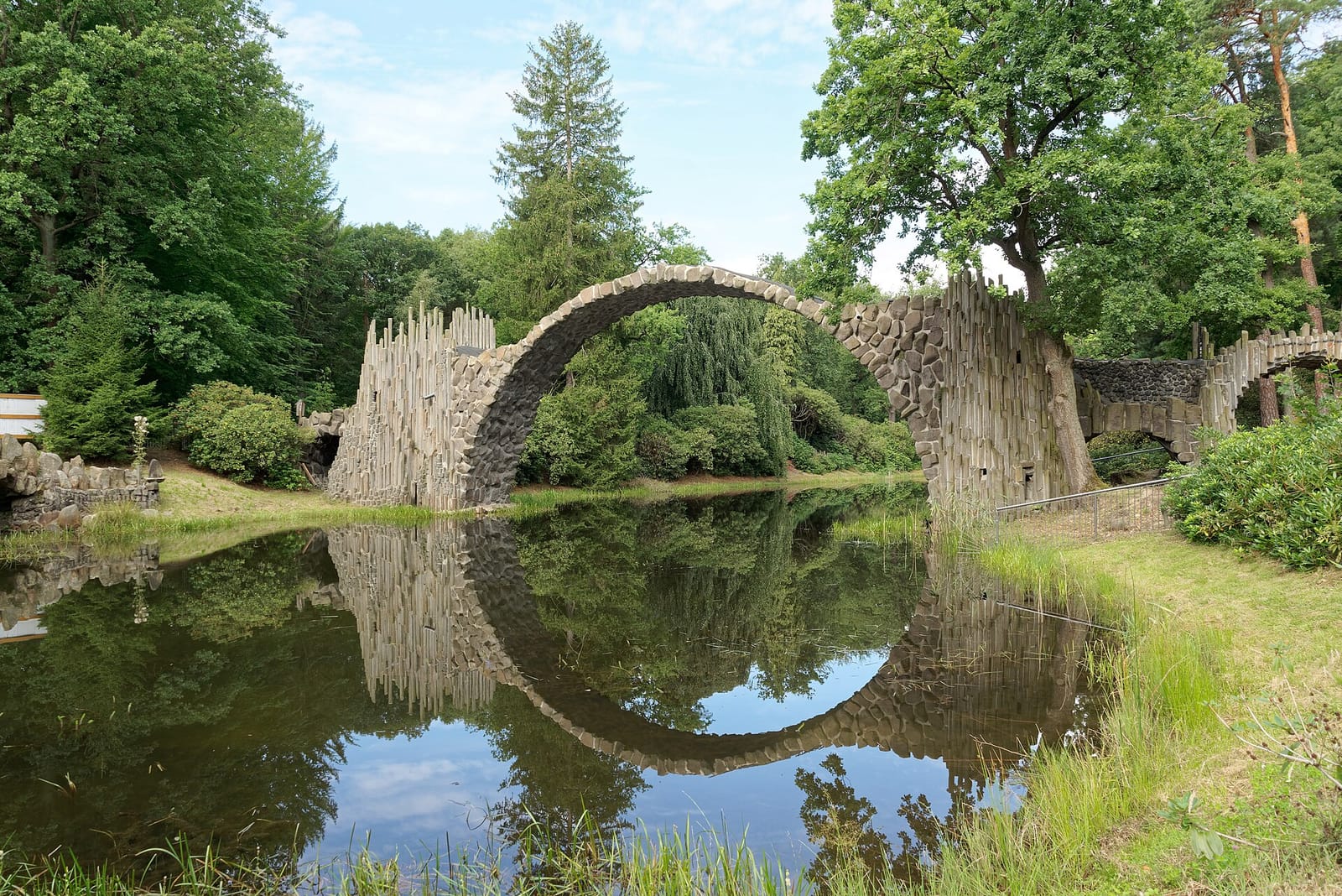 The Rakotzbrücke devil's bridge forming a circle with its reflection